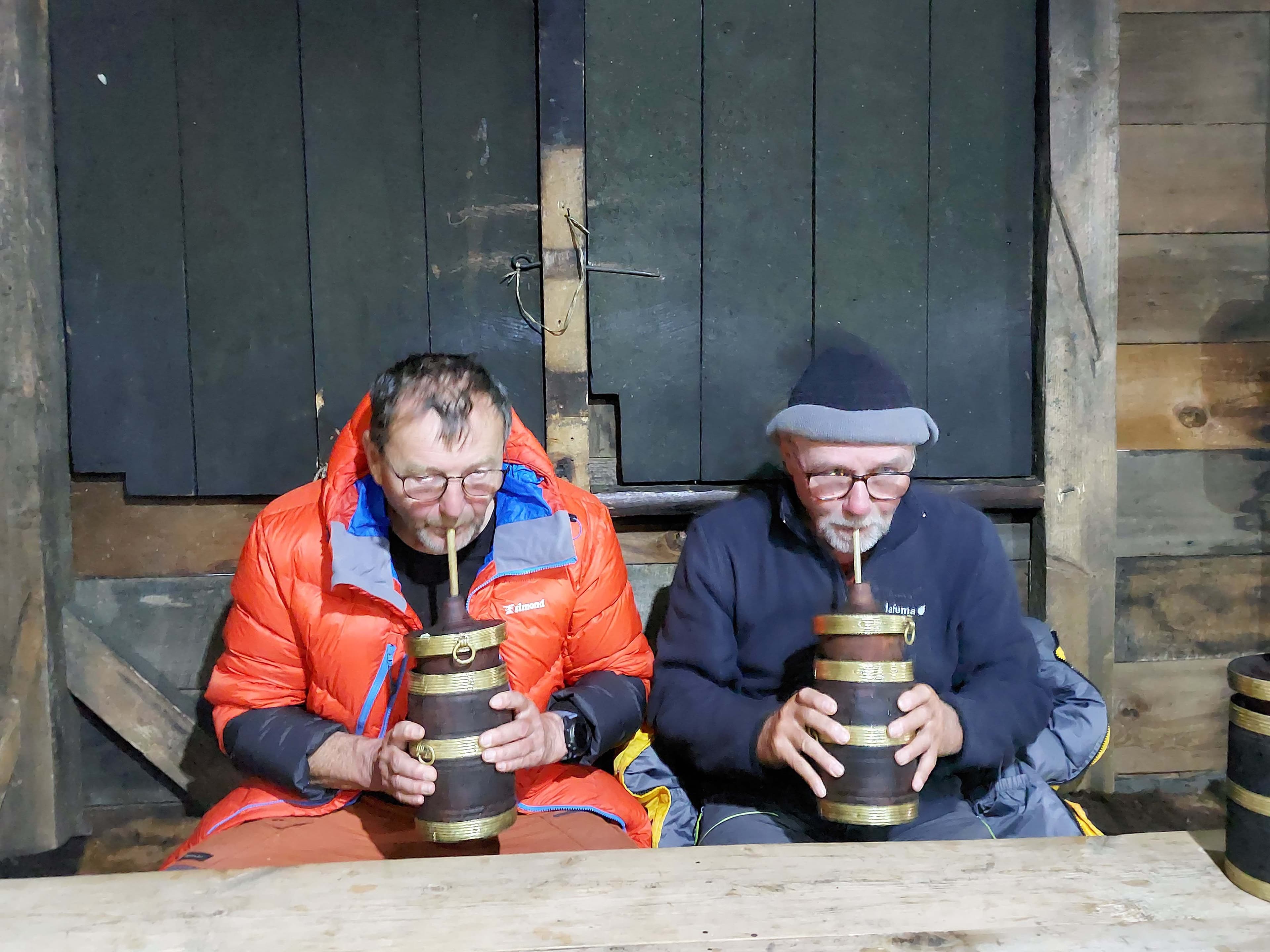 Trekkers of Trek 8586 enjoying authentic Tomba found in Kanchenjunga Region