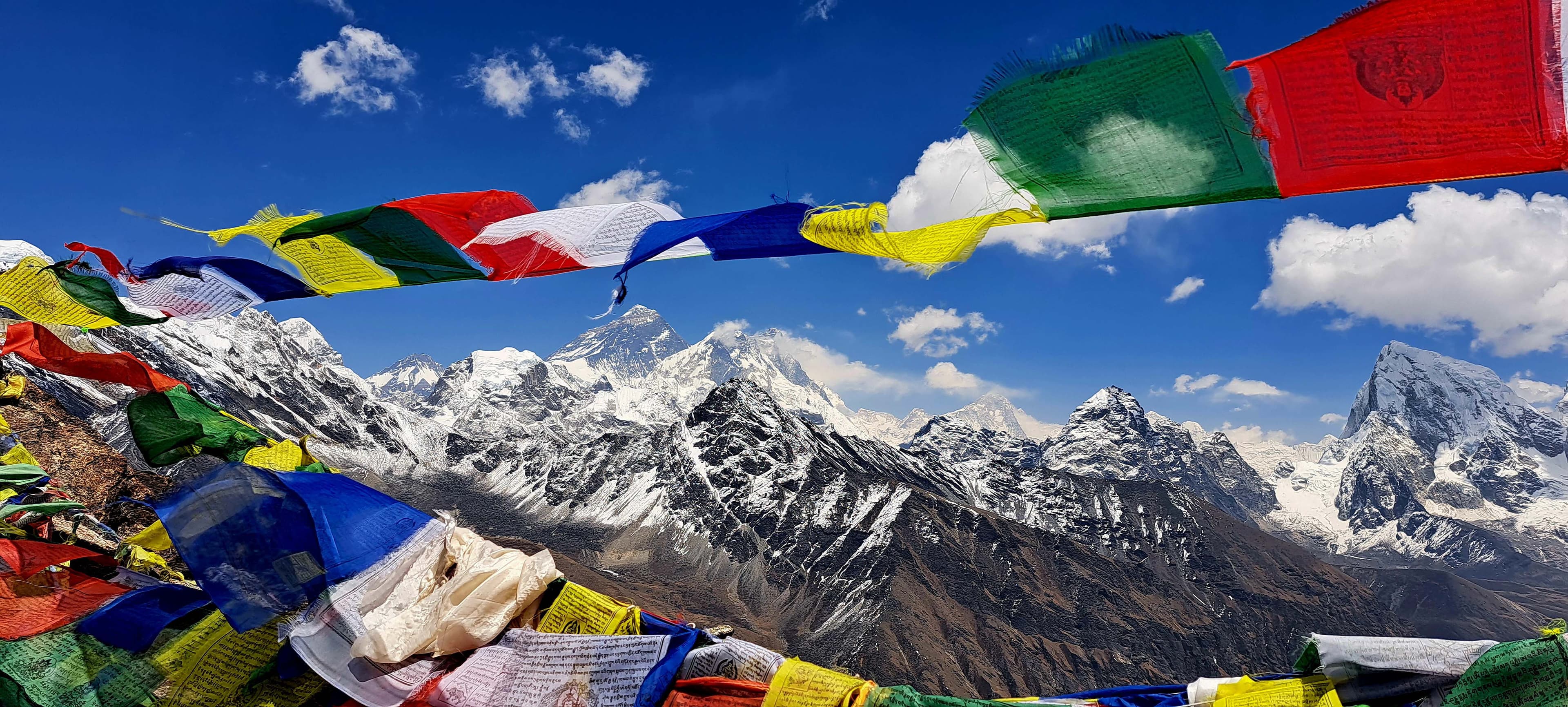 Mt. Everest on Everest Region with tibetian flag, captured by Trek 8586