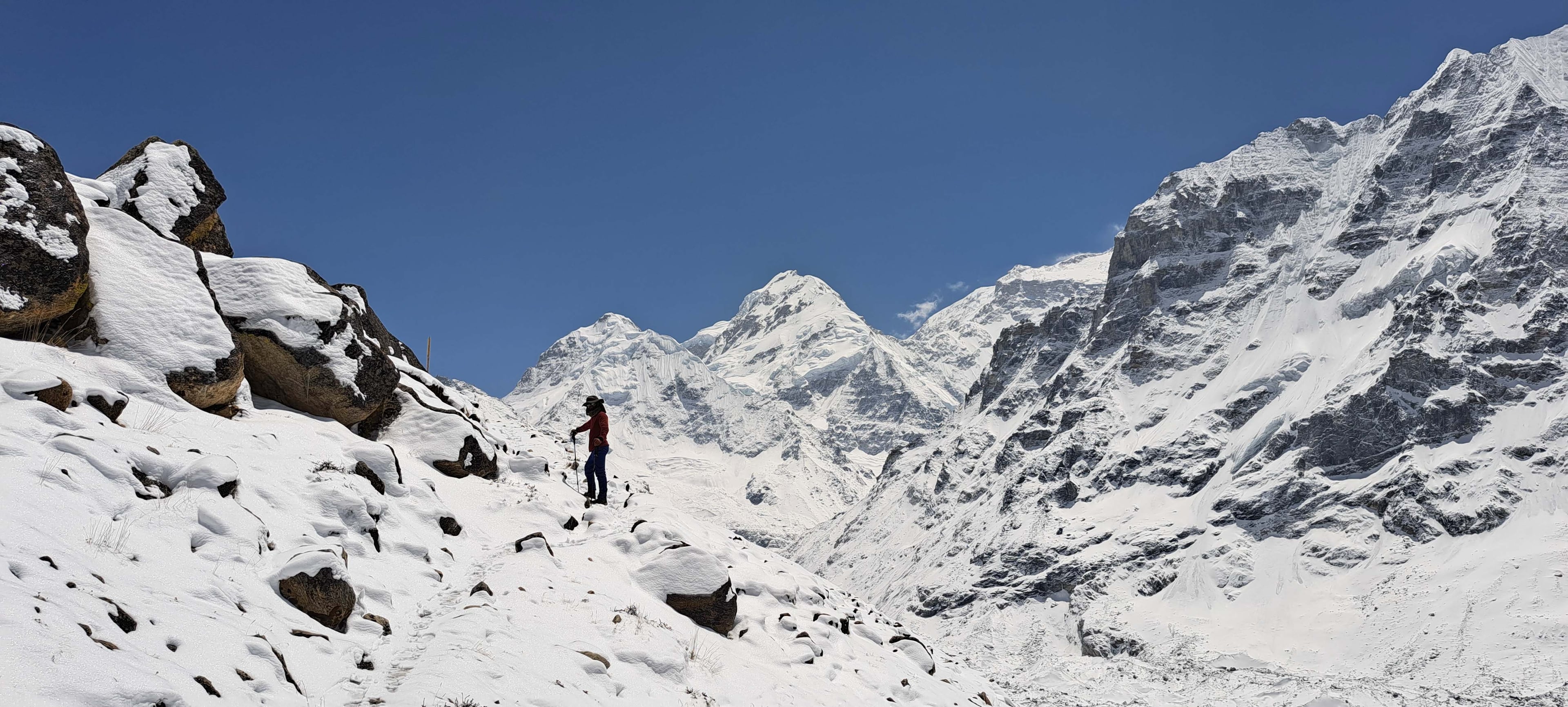 Manoj Basnet, esteemed member of Trek 8586, posing along the trails of Kanchenjunga in the Kanchenjunga Region, showcasing the scenic beauty of the trek.