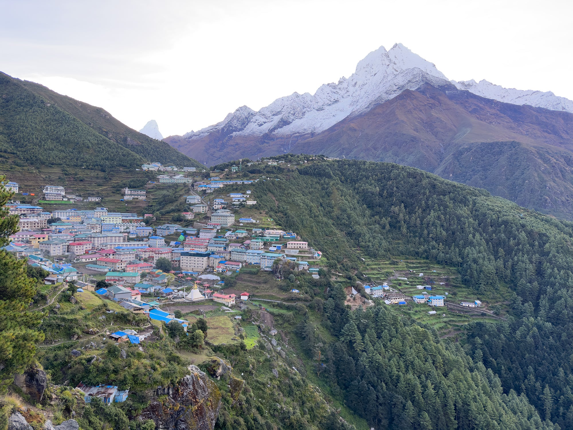 Scenic view of Namche Bazaar in the Everest Region, nestled in the Himalayas, offering a vibrant and bustling gateway for trekkers heading towards Mount Everest.