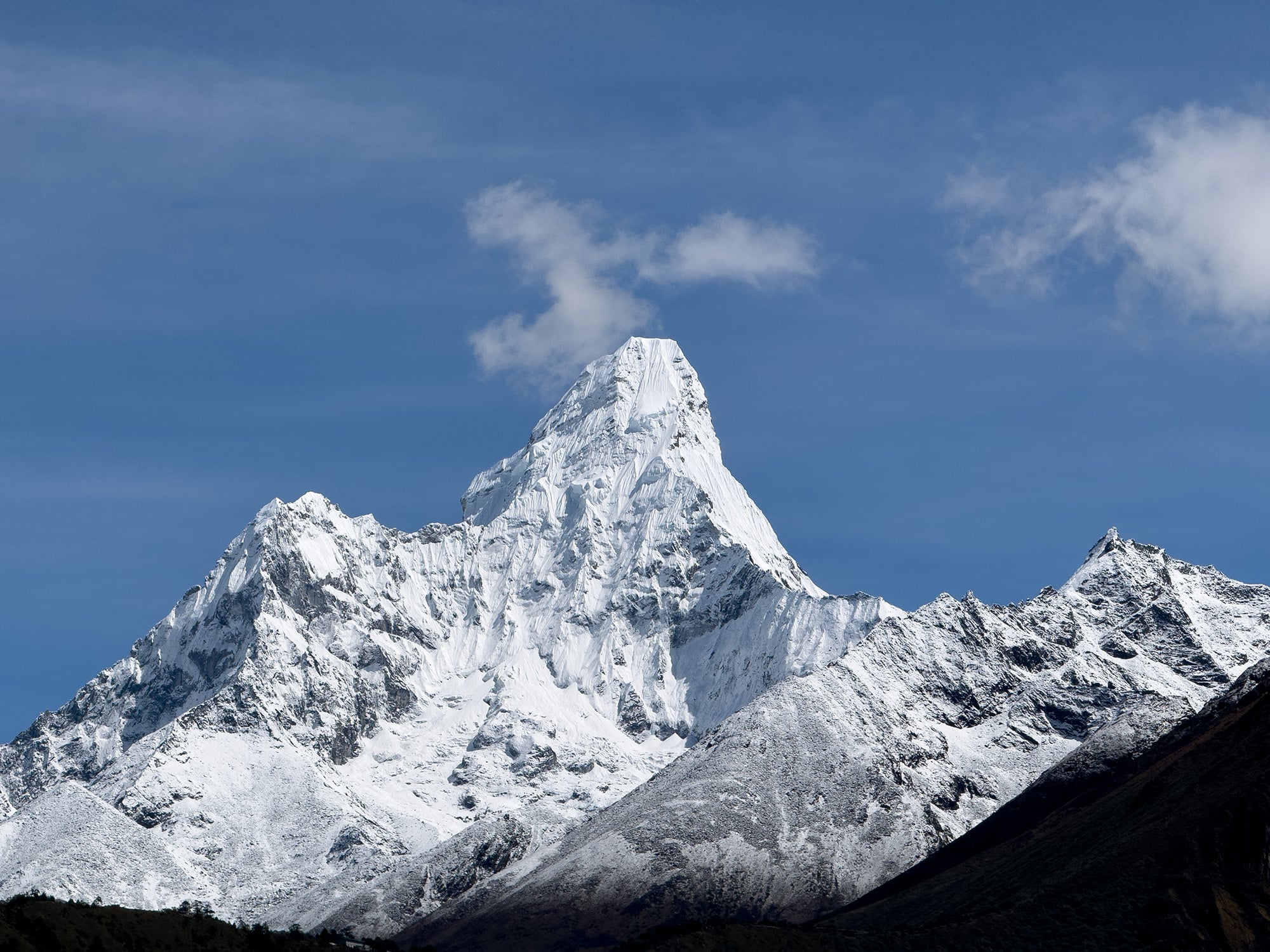 Stunning view of Ama Dablam, with its iconic pyramid-shaped peak standing tall against the sky, offering an awe-inspiring sight for trekkers in the Himalayas.